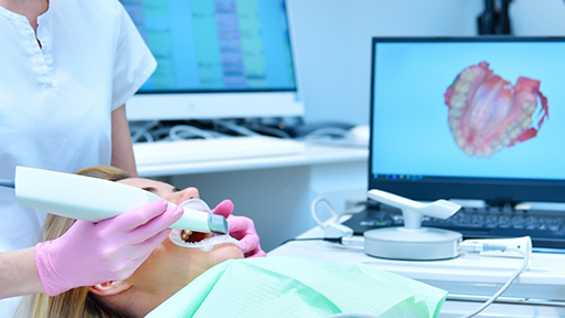 Dentist capturing digital impressions of a patient's teeth