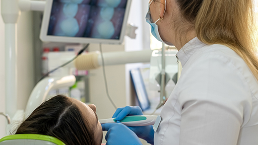 Dentist taking close-up photos of a patient's teeth