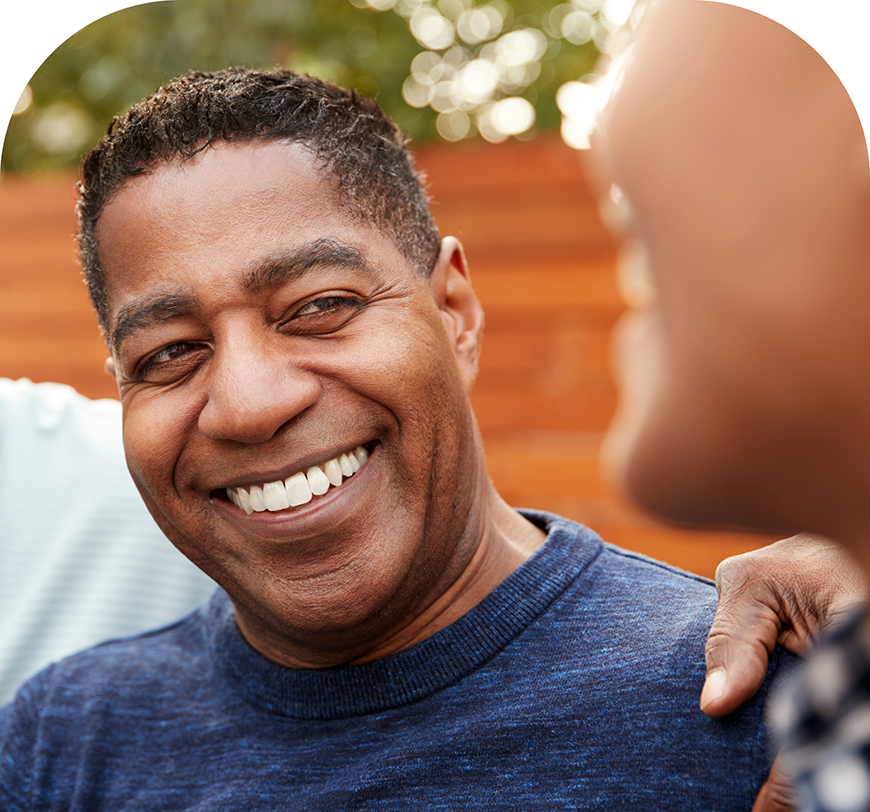 Older man smiling after cosmetic dental bonding in Burbank