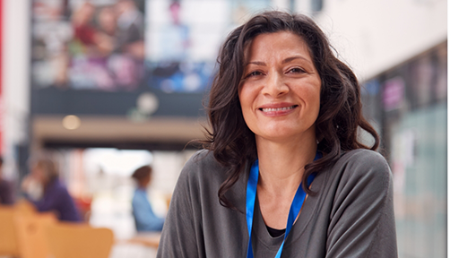 Teacher smiling in her classroom