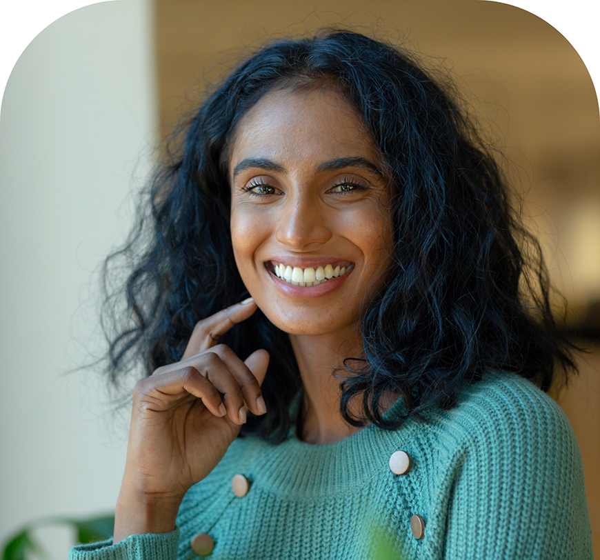 Woman with long dark hair smiling with flawless teeth after cosmetic dentistry in Burbank