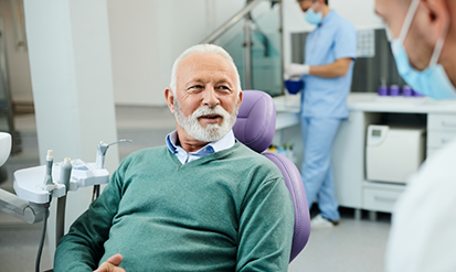 Senior man talking with his dentist