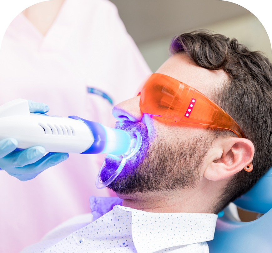 Man in the dental chair getting professional teeth whitening in Burbank