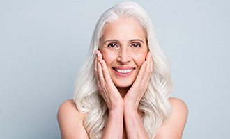 An older woman enjoying her new dental implants