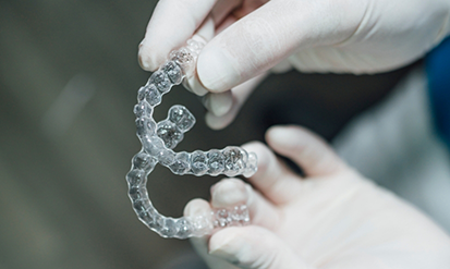 Dentist holding two aligners