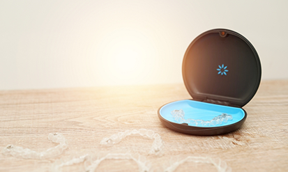 Clear aligners on a table with their plastic case