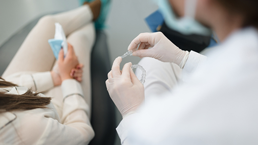 Dentist showing Invisalign to a patient