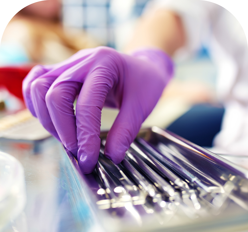 Burbank dental team member grabbing a dental instrument