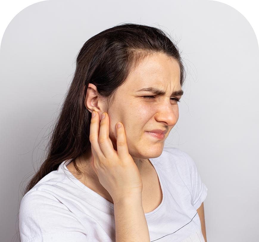 Woman holding the side of her jaw in pain