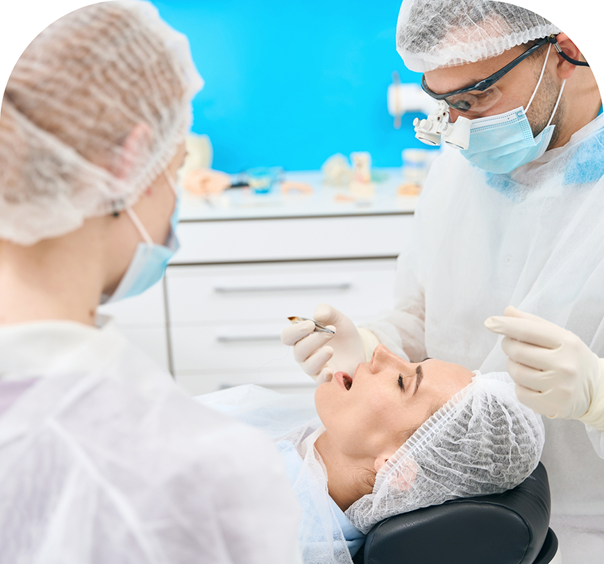 Dental team preparing to perform tooth extractions on a patient